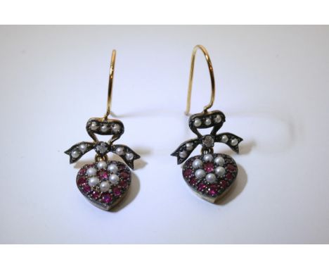 A pair of pearl, diamond and ruby heart shape drop earrings.