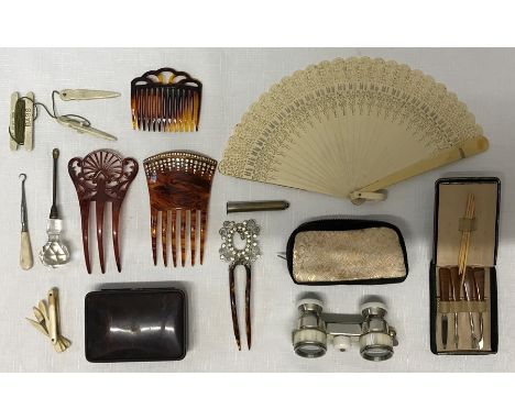 A collection of ladies accessories to include 10cm opera glasses with mother of pearl eye pieces, fan 28cms, manicure set in 