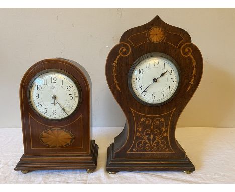 Two mahogany inlaid mantle clocks. 30 h x 18cms w and 23 h x 15.5cms w. Condition ReportSmall clock inlay lifting to top and 