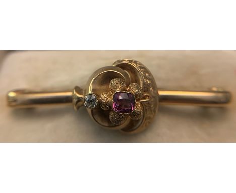 A 9ct gold bar brooch set with central amethyst and one diamond. In original fitted case. 5.4gms total.Condition ReportGood c