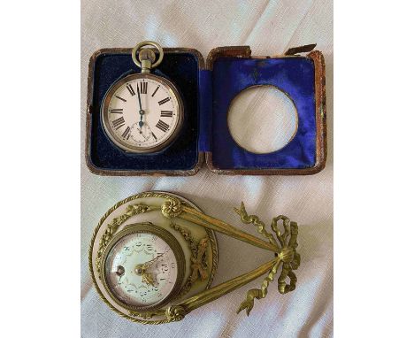 A 19thC Goliath watch in leather display case 12.5 x 11cms. Also an onyx and gilt mounted clock with enamel and painted face.