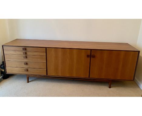 A large G-Plan 1960's retro vintage stained teak wood sideboard credenza comprising of a bank of five graduating drawers with