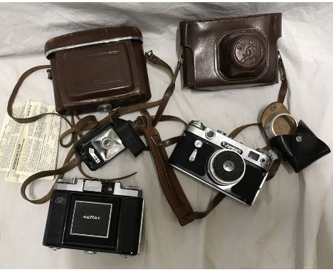 Cameras, Zeiss Ikon Nettax with flash unit and leather case and a Russian Zorki 6 camera with leather case. Condition ReportA