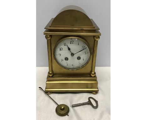 A French brass mantle clock, enamel face, movement marked Japy Freres GDE.MED.D. HONNEUR, has pendulum and key. 27 h x 18 w x