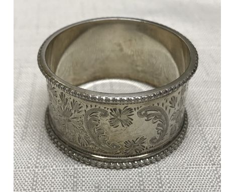 Hallmarked silver napkin ring, floral engraved, 4.5cms w, R and S, London 1916. 22gms. Condition ReportGood condition, no iss