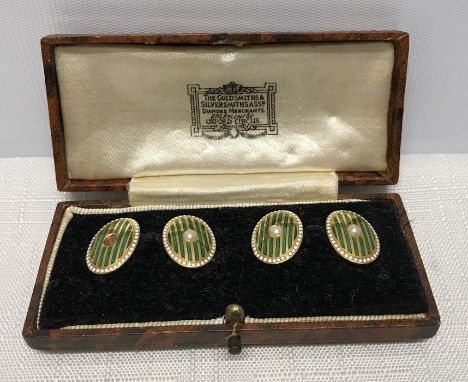 Cased pair of gents 18ct gold cufflinks with green and white enamel set with pearl. 9.9gms.Condition ReportOne pearl missing.