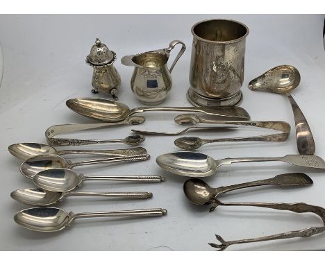 Hallmarked silver to include Christening mug, jug, pepper, sugar tongs, tea and dessert spoons ladle and salt spoons. 324.9gm