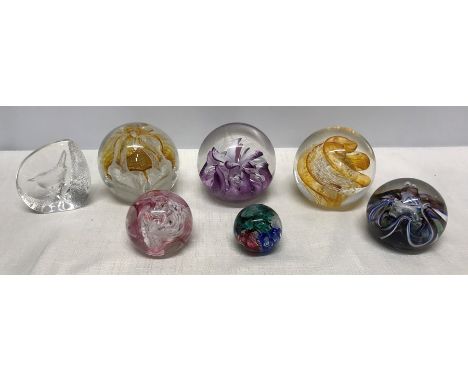 Collection of seven glass paperweights, 2 x Caithness, Mooncrystal and Congratulations. 4 x Selkirk Glass and one clear glass