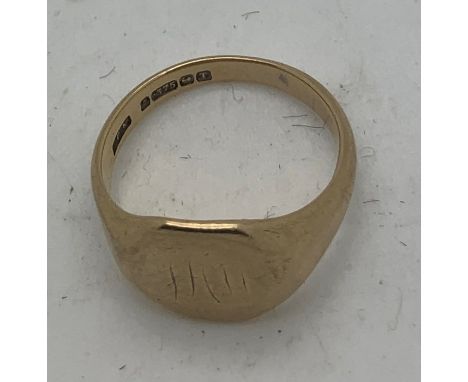 A 9ct gold signet ring 5gms.Size P. Initials to the front.Condition ReportInitials are worn and some scratches to the metal.