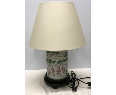 Chinese pottery table lamp on carved wooden base with shade, Fuchsia pattern, 54cms h including shade.Condition ReportVery go