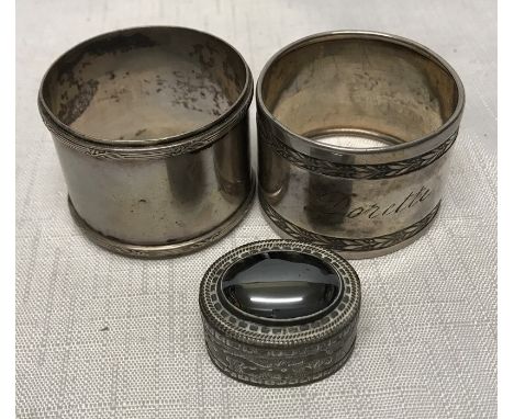 Continental silver, two napkin rings 800 silver and a decorative pill pox stamped 900.Condition ReportSlight bend to one napk