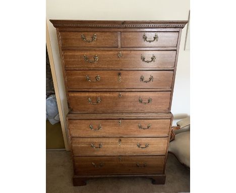 An 18thC oak chest on chest, original fire gilt handles, two short drawers on bracket feet. 100 w base x 52 d x 167cms h. Con