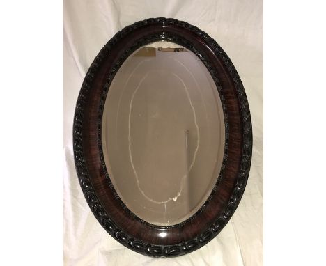 Large oval framed gesso wood effect bevel edged wall mirror. Frame 54 w x 82cms h, Condition ReportLight scratch wear to the 
