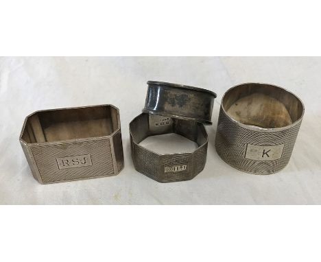 Four silver napkin rings. E.V London 1947, D. Bros Birmingham 1936. J.R Birmingham 1954 and J and C Birmingham 1919, together