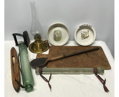 Mixed lot, two baby's plates, a dry Wicket and Hickory Dickory Dock, brass chamber oil lamp, iron, chopping board 41 x 24cms,