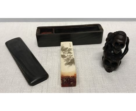 Japanese ivory chop cased in a horn box, signed and engraved with carp fish, 6cms l, box 9cms l together with a hardwood nets