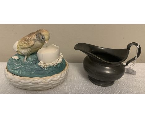 A 19thC lidded box with hatching chick to top. 13cms l x 10cms w with Dixon and Son pewter jug. Condition ReportLight chips t