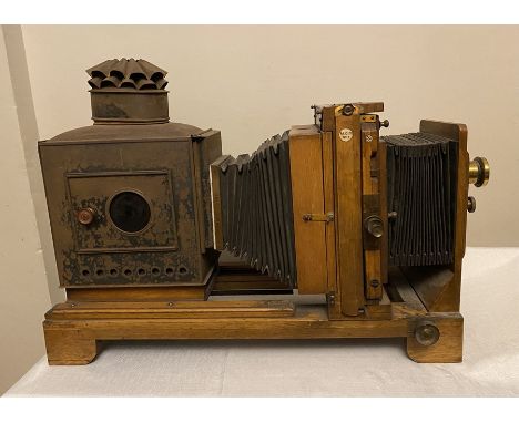 Thornton Pickard MCC No.6 oak projector with brass lens. 74cms l. Condition ReportUnrestored.&nbsp;