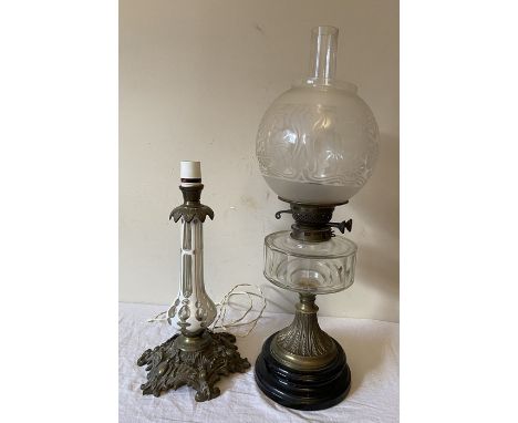 A 19thC brass and clear glass oil lamp with etched shade and back ceramic base together with a glass overlay and brass table 