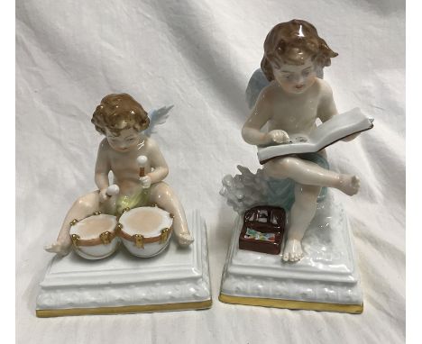 Two Scheibe Albach porcelain figurines. Cherubs, one sat on a plinth painting in a book 15cms h and Cherub playing with drums