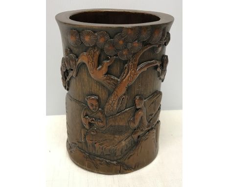 Chinese carved bamboo brush pot, two gentleman playing a board game. 16.5 h x 12cms w. Condition ReportSome split to the bamb