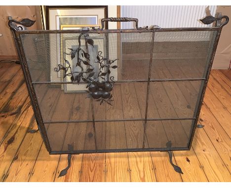 A metal and mesh fireguard with floral decoration to the front. Closed 70w x 69cms h. Fully opened 114cms w Condition ReportG