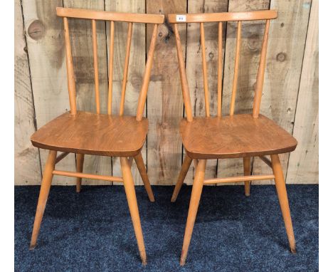 A Pair of 1960s Lightwood Ercol "stick back" Design Chairs