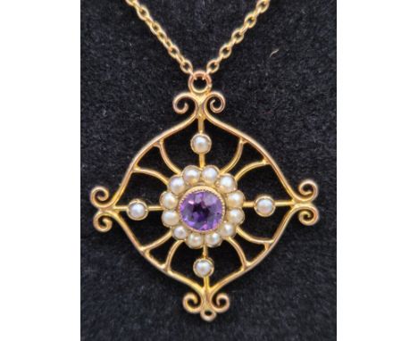 Edwardian 9ct yellow gold Amethyst and seed pearl pendant with a 9ct yellow gold integral barrel clasp chain. [3.37grams] [Te
