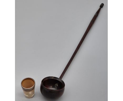 A Georgian Wooden toddy ladle together with a small Doulton Lambeth and Chester silver rimmed shot glass. [Ladle- 43.5cm] 