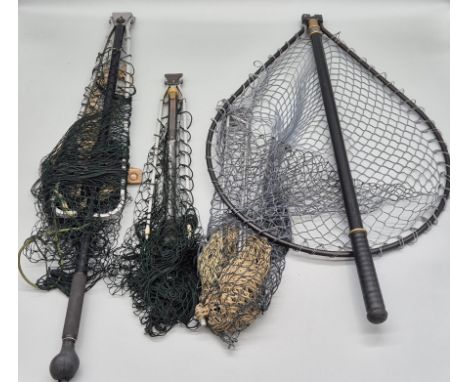 A collection of vintage fishing nets; two Hardy Brothers Alnwick fishing nets & Whitlock net & others