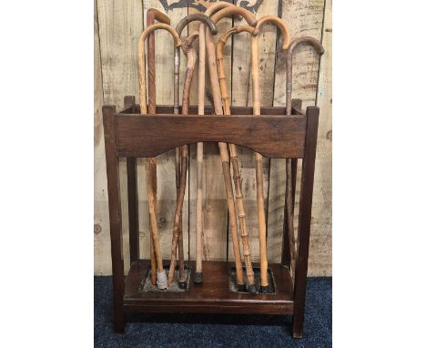 1920/30s mahogany stick stand with a collection of vintage walking sticks; Silver collars walking sticks &amp; others