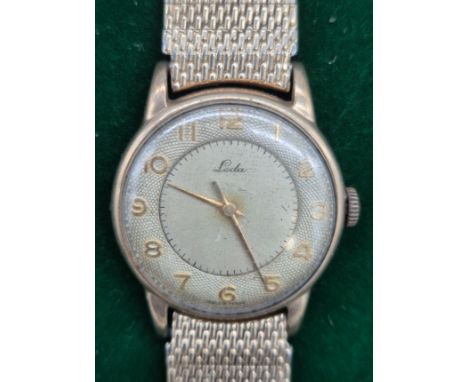 A Vintage gent's 9ct yellow gold cased wristwatch produced by Leda. Fitted with a plated bracelet strap [back plate-4.87grams