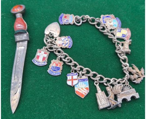 Silver charm bracelet fitted with silver and enamel souvenir shield charms. Together with A dirk shaped bookmark-Birmingham s