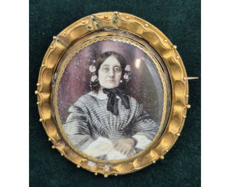 19th century Mourning brooch, swivel section is plated and having a hand painted portrait of an elderly lady and having braid