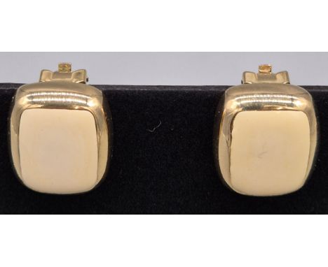 A Pair of Vintage Christian Dior Creme enamel clip on earrings 