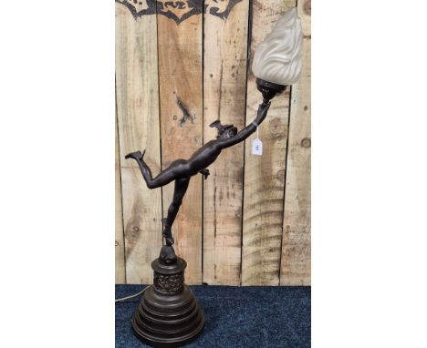 A Large Bronzed Spelter "Mercury" figure table lamp. Mercury holding a flamed torch. frosted flame shade. Mercury raised upon