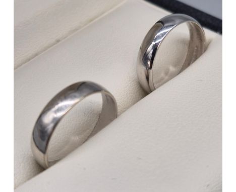 A Lot of two 9ct white gold wedding bands. [Ring size K 1/2] [3.85grams] 