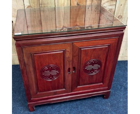 Chinese Rosewood two door unit. Fold away doors leading to shelf interior. Has glass protector to top. [78x76x51cm] 
