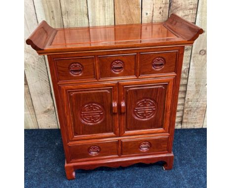 Chinese Rosewood console unit. Three small drawers over two doors over two drawers. [85x74x35.5cm] 