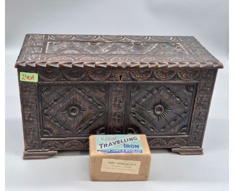 Antique hand carved oak smokers chest together with a small vintage travel iron. 