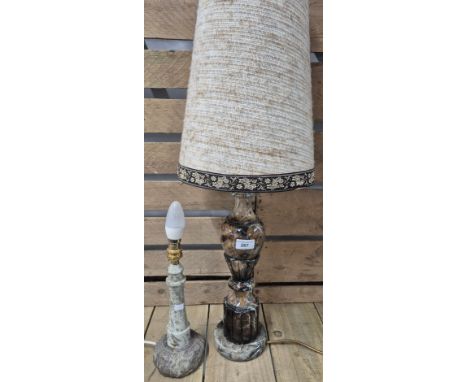Two various table lamps; heavy marble table lamp with shade and carved granite stone lighthouse shaped table lamp. 