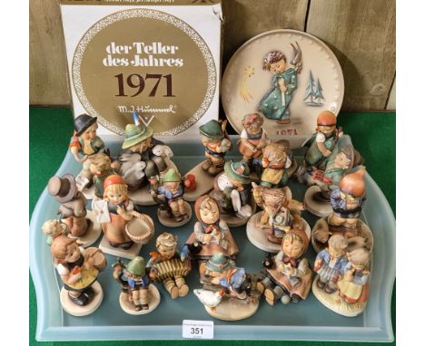 A Large Collection of Goebel Hummel pottery figurines &amp; collector plate boxed. [As found] 