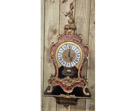 Large French Boulle and ormolu mounted mantle clock. Comes with bracket wall shelf. [Clock- 80cm high] [Bracket wall shelf- 2
