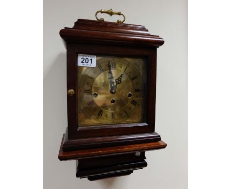 Reproduction quality Mahogany Westminster chime clock with wall bracket, German movement, height 33cm  (2)