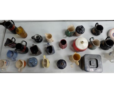 A collection of ceramic pub advertising ashtrays, jugs icebuckets including Wills, Dunhill , Black Label, Haig , Teachers etc