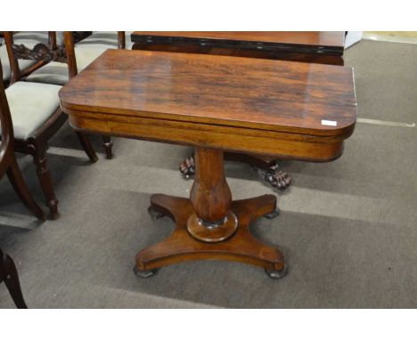 A 19th Century rosewood veneered card table with folding top with a blue baize lined interior over a tapering bulbous pedesta