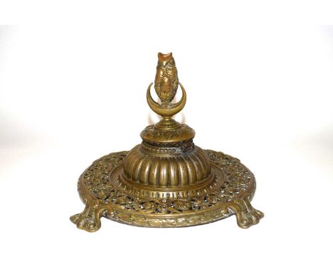 Late 19th Century cast metal ink well, the finial modelled as an owl with metal scroll work borders, 21cm high