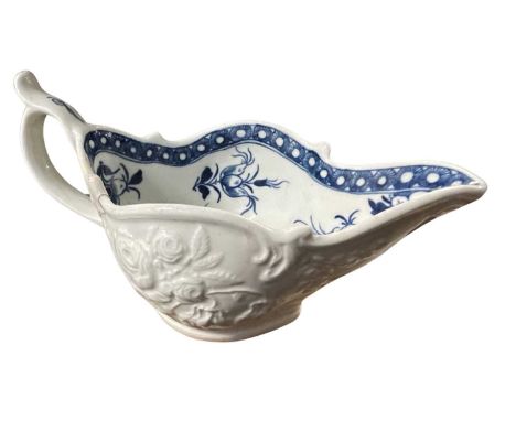 A Worcester porcelain sauce boat of shaped form with moulded design of flowers (a/f)