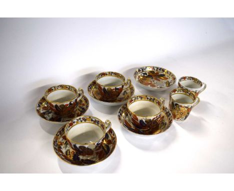 Group of late 18th Century cups and saucers, probably New Hall with a tobacco leaf type design comprising four cups, two cans