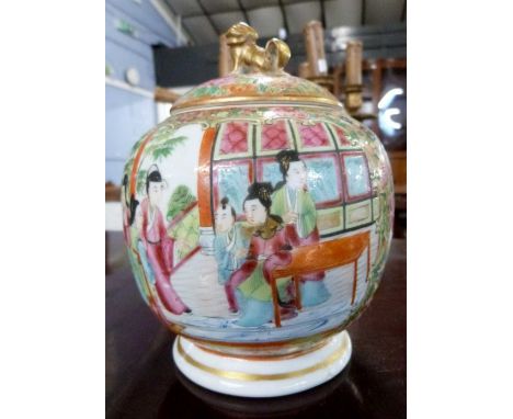 A 19th Century Cantonese porcelain jar and cover with polychrome design of Chinese figures, the jar with lion finial